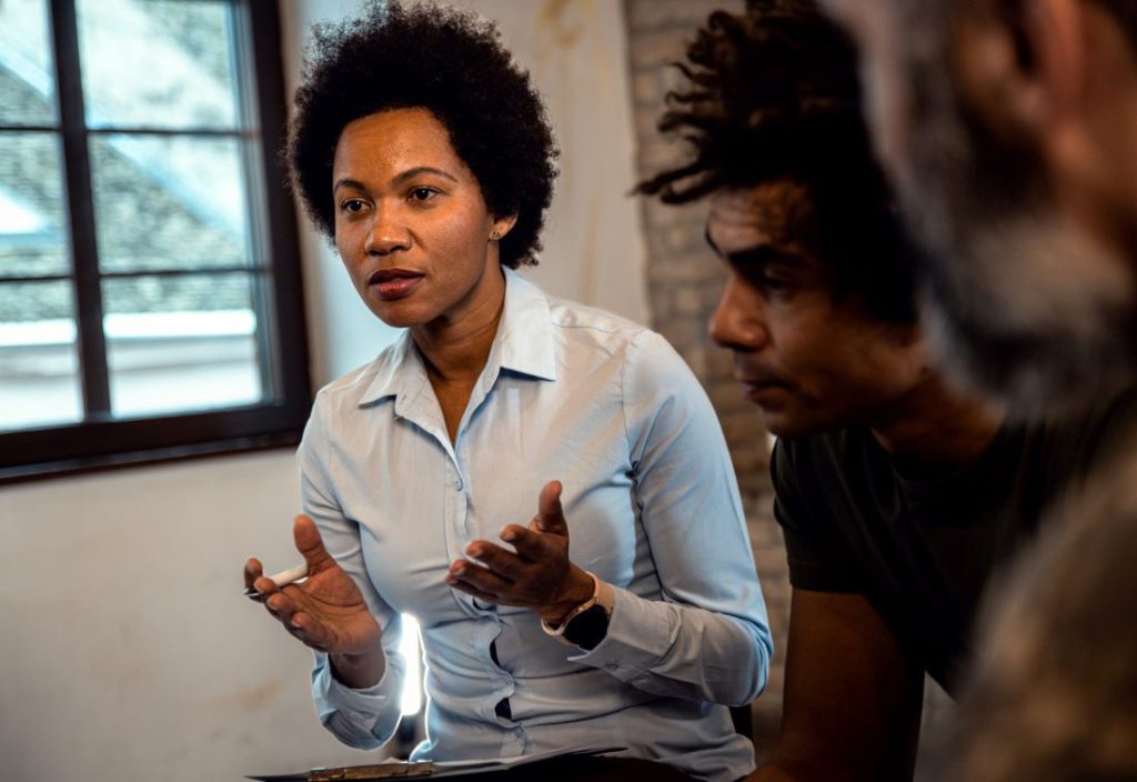 A professional explaining what you can expect with intervention services